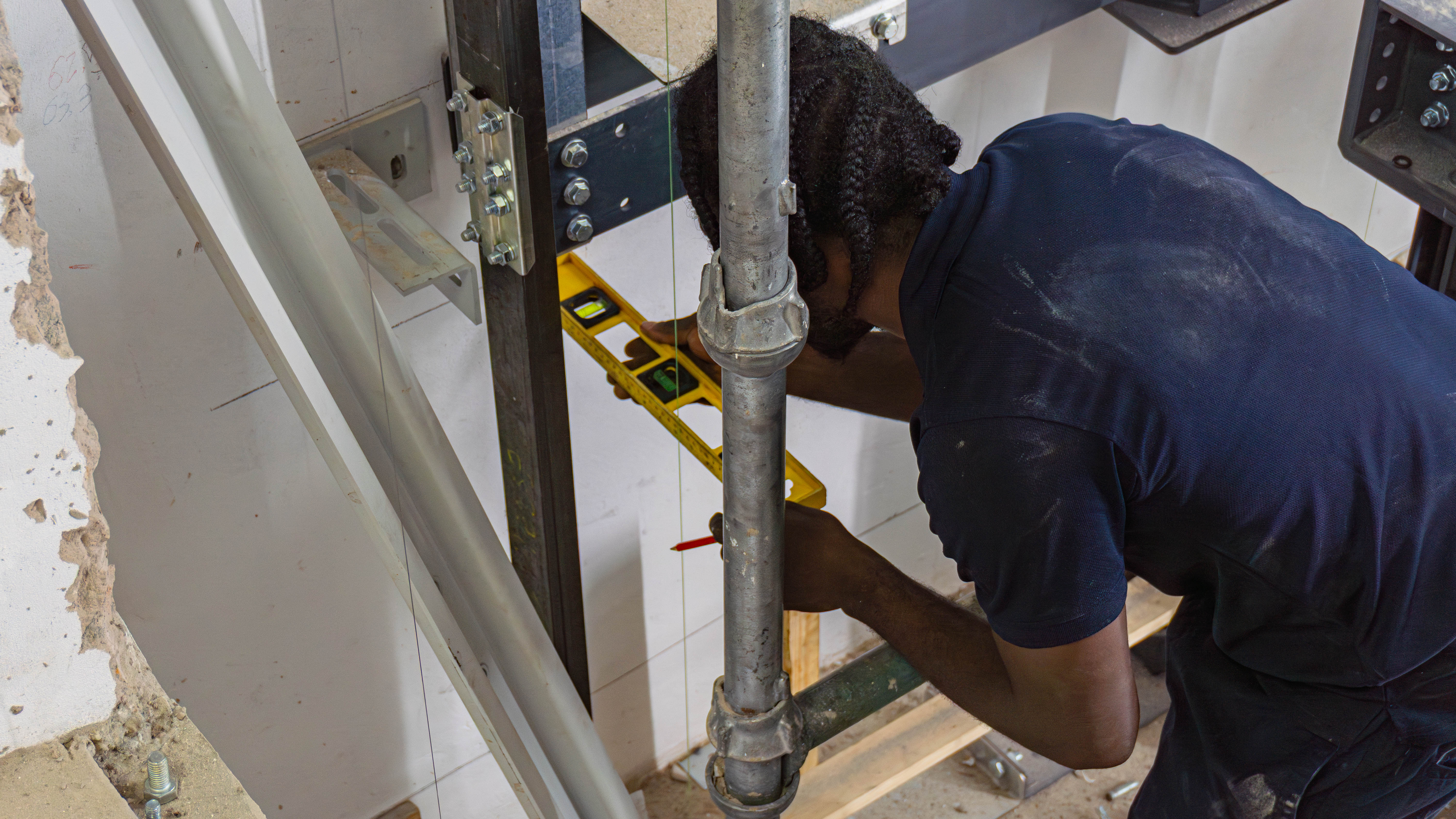 One of our technicians finalizing measurements as a new installation is underway at Barrackpore Medical