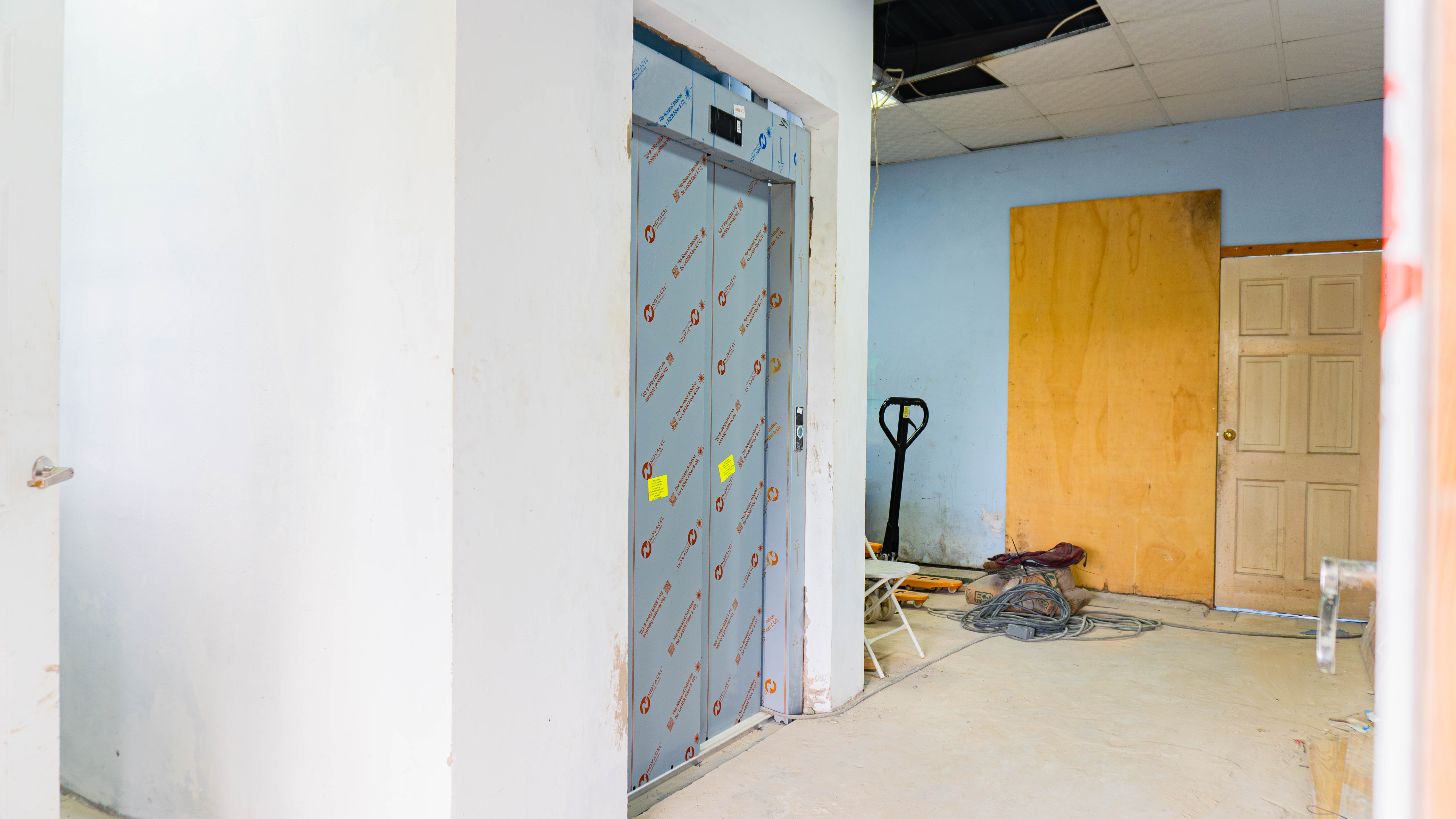 showcasing Elevator installation in newly constructed elevator shaft